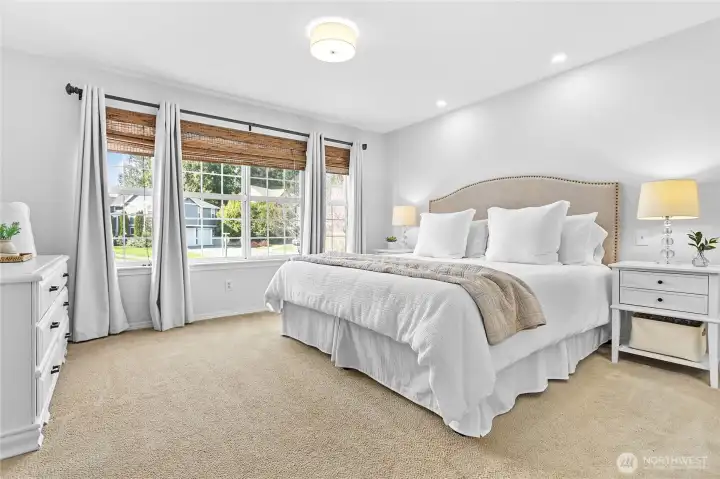 Primary bedroom with walk-in closet and en suite bathroom
