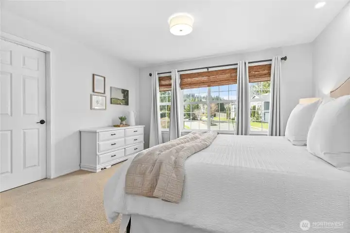 Primary bedroom with walk-in closet and en suite bathroom