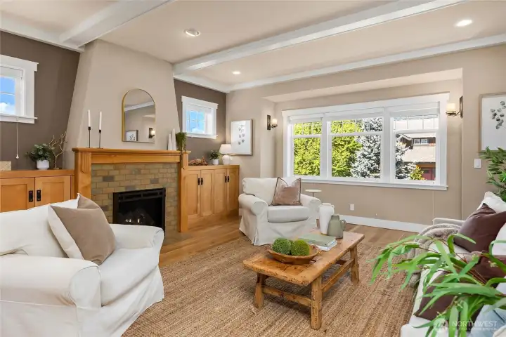 Beautiful character details are featured throughout, including the maple built-ins, beams in the ceiiings and beautiful tile work around the propane fireplace.