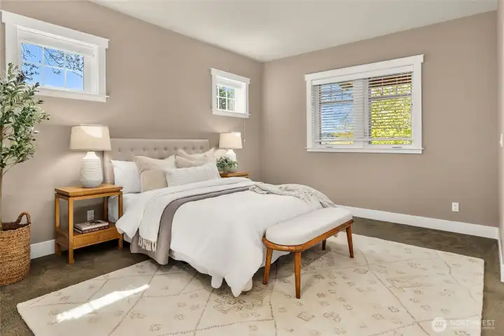 Located on the main-level, the primary ensuite is well-appointed with a bright spa-like bath and large walk-in closet.