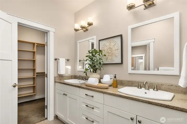 Lots of natural light floods the primary bath with a skylight overhead.