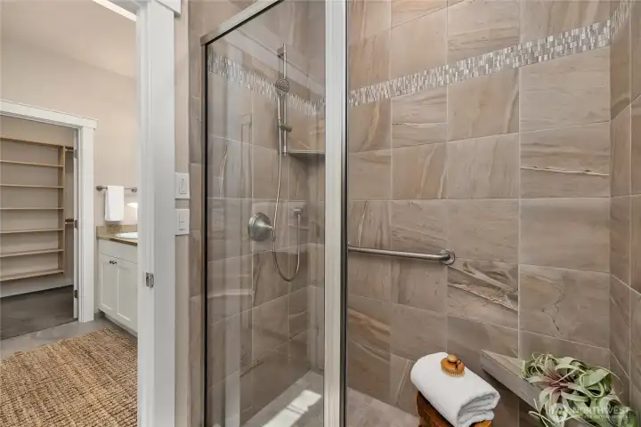 The shower and water closet close off from the vanity area, providing more privacy.
