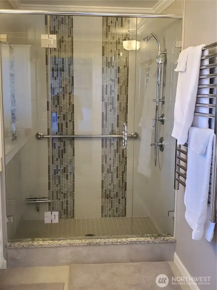 Custom shower in the primary with built-in towel warmer!