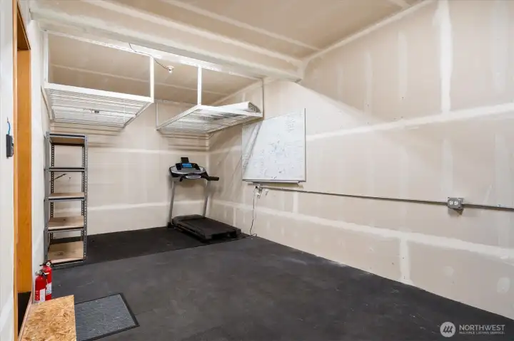 Garage with dedicated work out space Garage with dedicated work out space