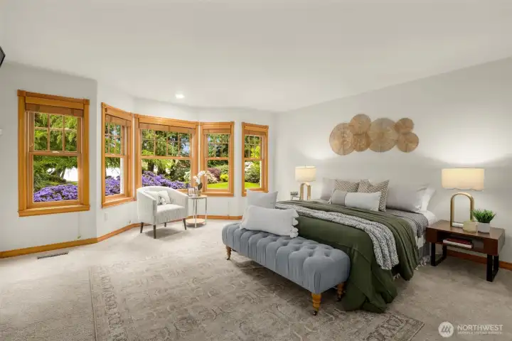 Exceptional primary suite with lake views, large walk-in closet, soaking tub, walk-in shower, and separate his-and-hers bathrooms