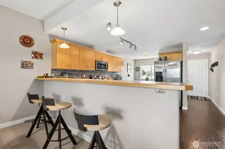 The open concept kitchen and breakfast bar.