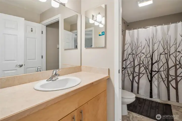 Guests will love the privacy from the sink to the water closet in the guest bathroom.