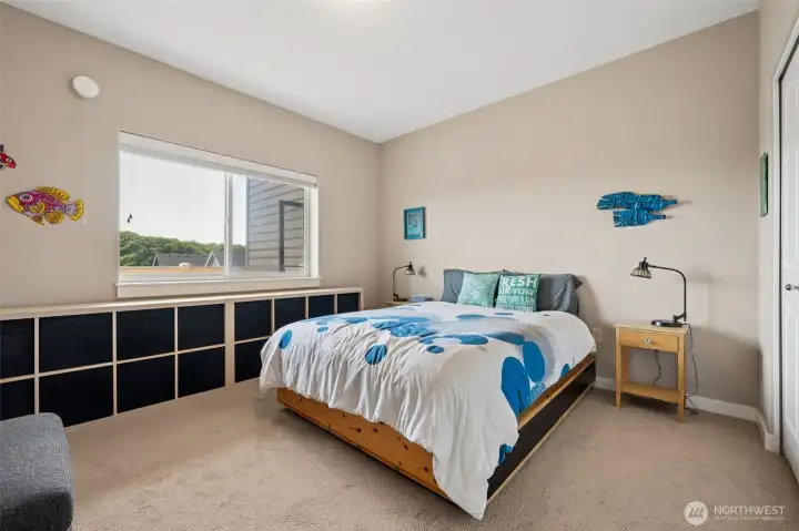 Guest bedroom is spacious and inviting.