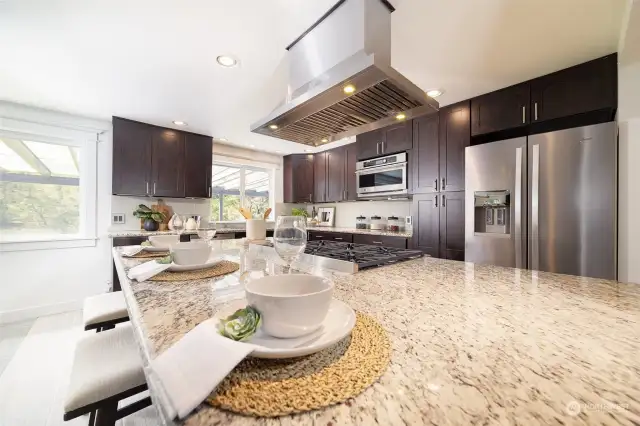 Chef’s kitchen with high end Stainless Steel appliances, including a Décor gas stove.