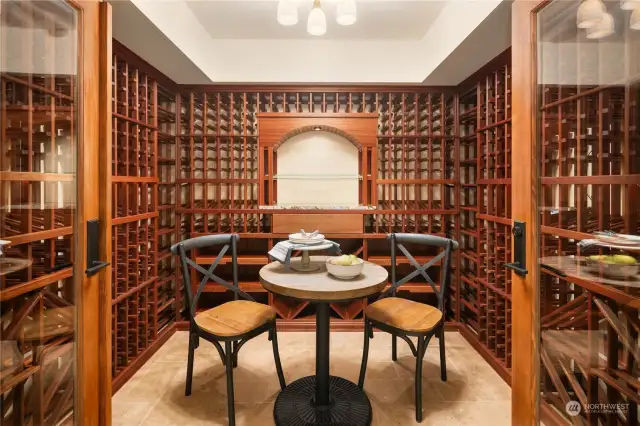 Climate controlled wine room with storage for over 1,000 bottles.