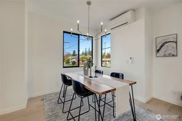 Dining room is open to the kitchen. The attention to detail really shines through with the unique light fixtures that are sure to be talking points while you entertain.