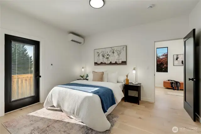 Main floor 2nd primary suite just off entry  with WIC and ensuite bath.