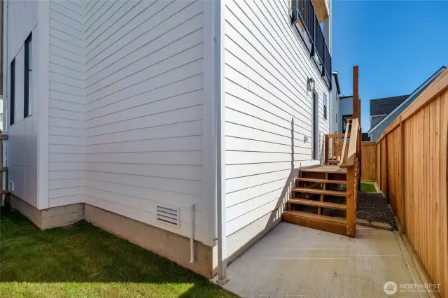 Access to the deck and yard from the main level primary suite.