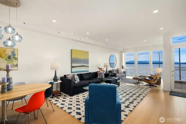 Expansive walls of glass frame breathtaking views of Sound, islands, and marine life, thanks to steel beam construction lending itself to commercial-grade quality while retaining the warmth of beach front living.