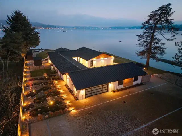 Welcome home to paradise in Poulsbo. With over 400 feet of 2-sided, low bank waterfront, there is a breathtaking view from every angle. Directly across the property is Downtown Poulsbo, the Poulsbo Marina, and Mt. Rainier in full view on a clear day. Dramatic landscape lighting surrounds the property.