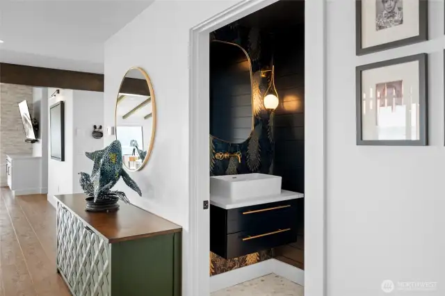 Your guests will love the conversation pieces in this chic powder room!