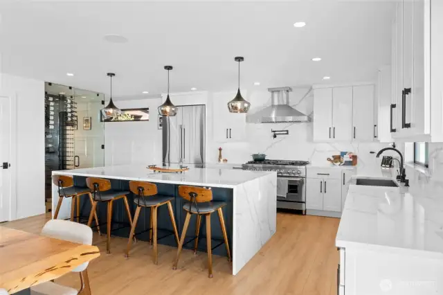 The open concept from kitchen, to dining room, to wet bar and living room is seamless - be prepared to have every party here.