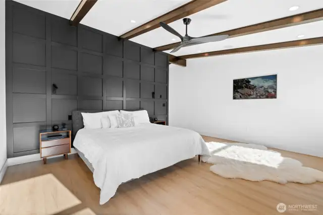 Primary suite is light-filled and spacious. Shown here with a King sized bed.