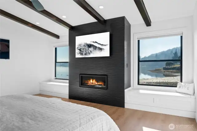 Enjoy the views, watch your favorite movie, and relax with a gas fireplace without ever having to leave bed. Custom built-ins for additional storage.