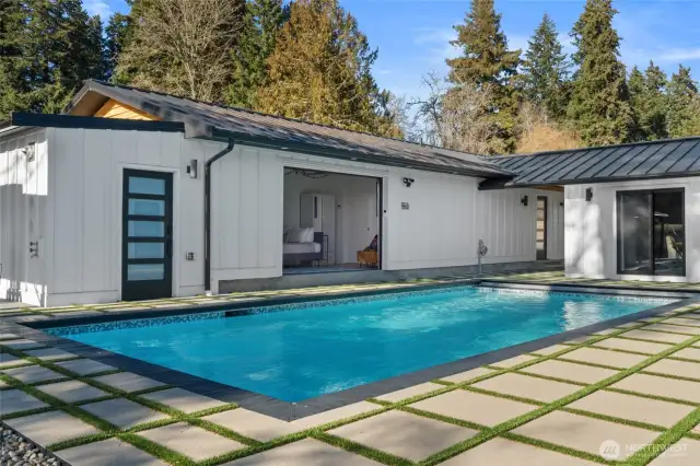 Within the courtyard is an in-ground, salt water headed pool with retractable cover and turf inlayed pavers for easy maintenance. Pool room complete with state-of-the-art pool equipment as well as ample dry storage.