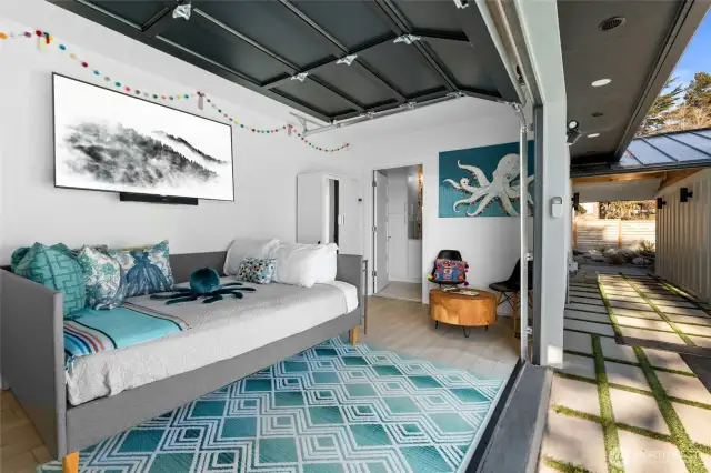 Enjoy this whimsical pool cabana complete with queen sized bed, kitchenette with retro refrigerator, sink, dishwasher and access to a 3/4 bathroom. Excellent private space for guests or to entertain poolside.