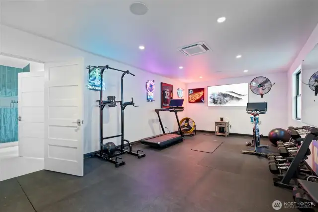Why bother with a gym membership when you have space for your own private gym? Complete with gym-grade flooring and a full wall of mirrors, as well as A/C to stay cool while getting healthy!