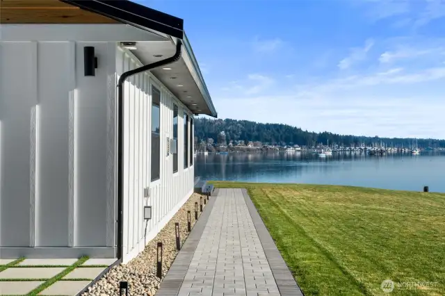 Sitting on over an acre of property, there is plenty of level yard (complete with sprinkler system) to enjoy every outdoor activity you could dream of. Tasteful landscape lighting surrounds the property so you can enjoy your time day or night.