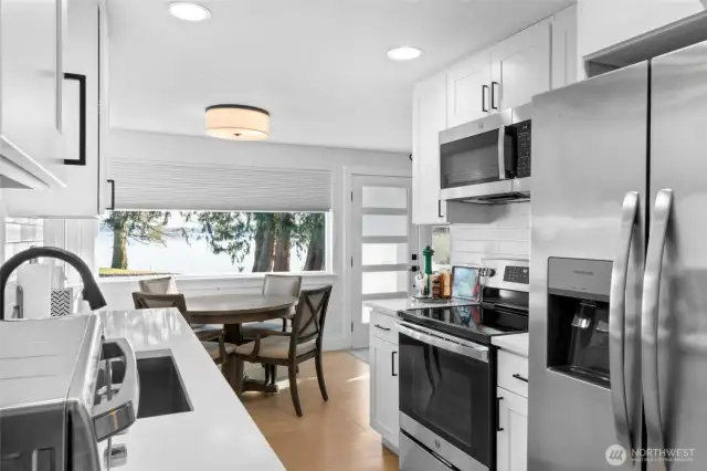 Stainless steel appliances throughout the second home as well. Off the kitchen is a huge utility room for so much additional storage.