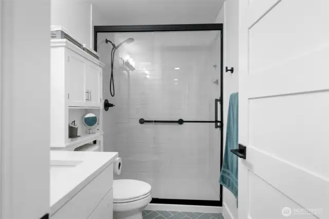 Second home bathroom includes a spacious tiled shower and modern finishes.