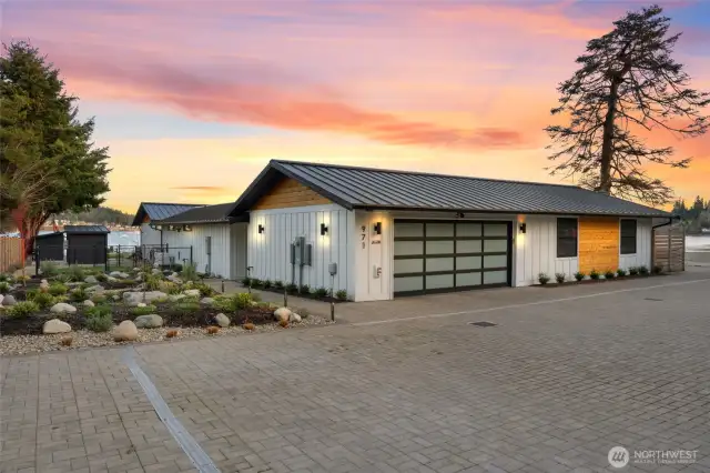 Professional and easy-maintenance landscaping throughout the property. There is also a fully-fenced, discreet dog run with pet turf to make sure there is never a muddy paw in the home.