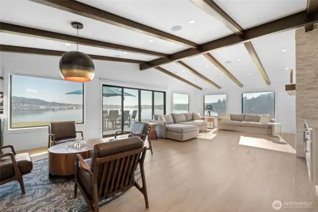 You've arrived! The open concept has been thoughtfully designed to maximize sunlight and VIEWS from every window! Living area as well as primary suite include stylish wood beams along the vaulted ceilings.