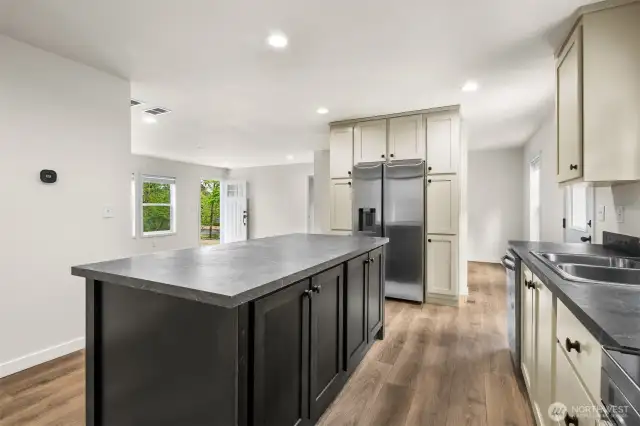Formal dining space and eating bar for ample dining options