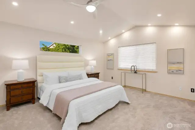 Spacious primary suite with vaulted ceiling