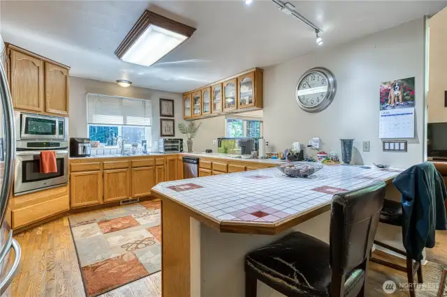 Kitchen is spacious with lots of cabinets and counter space.