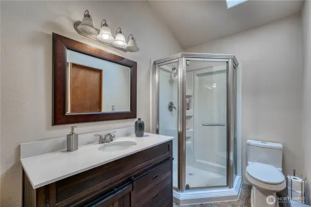 Freshly updated primary bath is adjacent to the walk in closet.