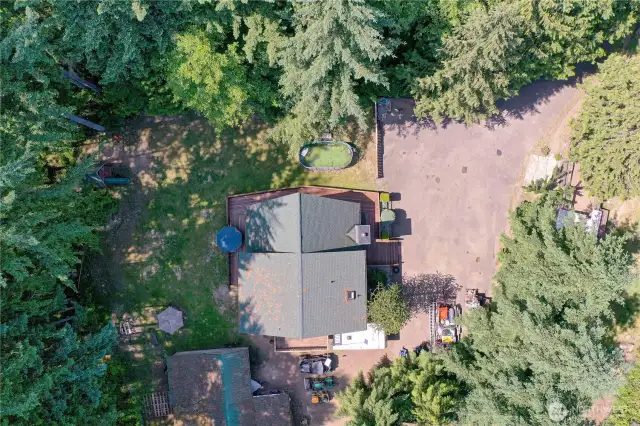 Aerial view of home with shop in the lower left and chicken coop up to the right.  Lots of room for parking, just imagine...a camper, boat, you decide.