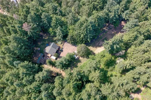 Your own private nearly 2.5 acres.  Would make a great hobby farm.