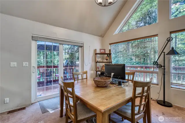 Dining room located right off the kitchen and slider to the wrap around deck.