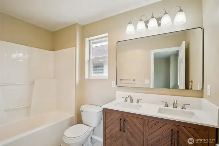 Primary bath with new vanity and flooring