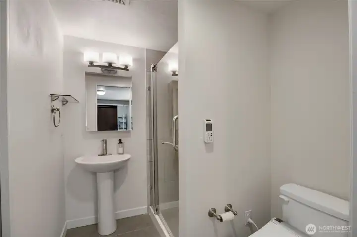 The aforementioned attached 3/4 bathroom.