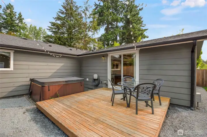 Step outside into the fully-fenced back yard complete with a fully functional hot tub with a brand new cover!  You will love this space, totally private.  Even the Catenary back yard lights are ready for a party!
