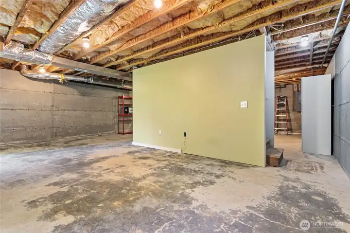 The basement, accessed by a stairway in the hall of the main level, has so much room for storage, it's ridiculous!