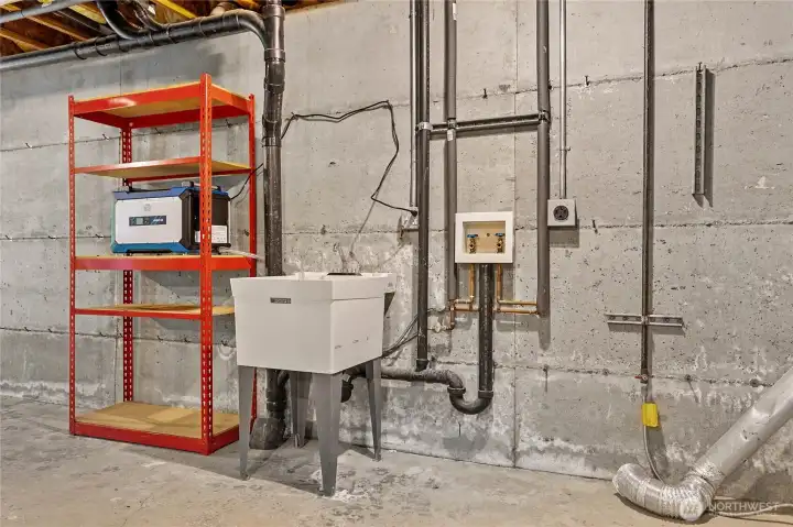 Pre-plumbed with a sink and hookups for a washer/dryer. The sellers toyed with installing a bathroom down here. Why not?