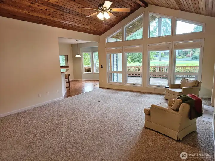 Beautifully laid ceilings warm this large main room looking out to golf fairway