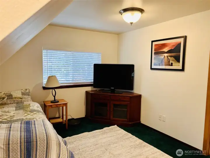 Upstairs loft sleeping space. TV included.