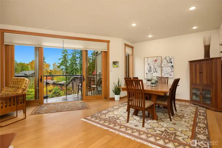 Both the living room and dining area have newly refinished bamboo floors and benefit from the double glass sliding doors out to the deck. Roller shades have been installed for sun screen when needed.