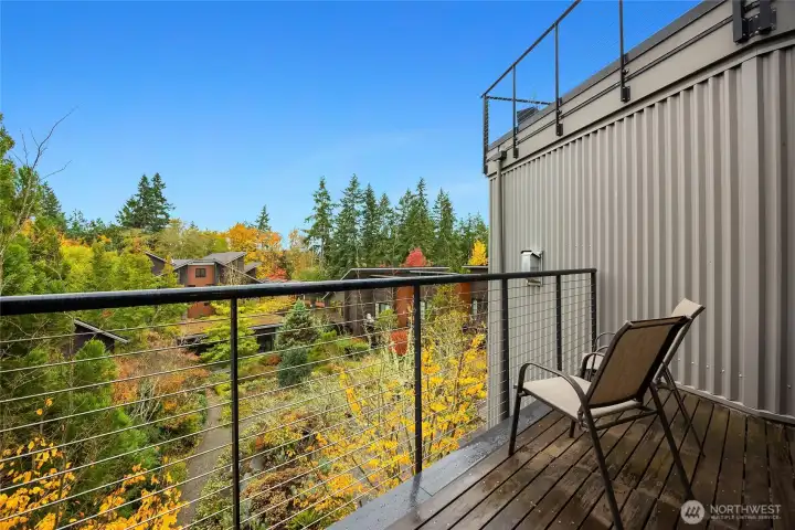 The main floor deck is located right off the living/ding room areas- what a stunning view!