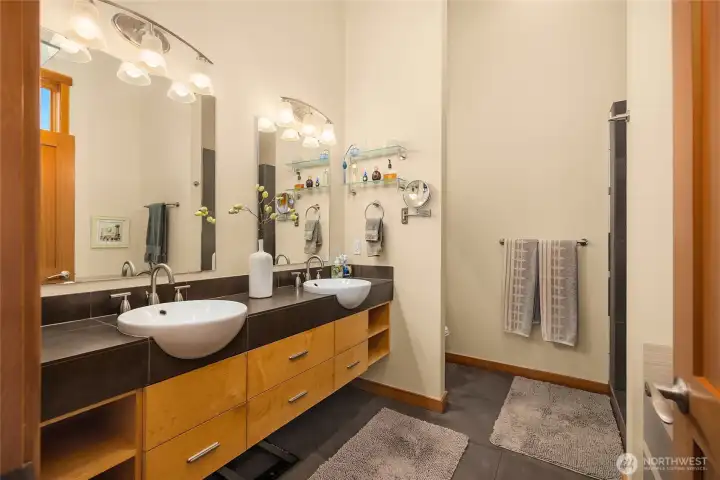 Double sinks and plenty of storage in the primary bath.