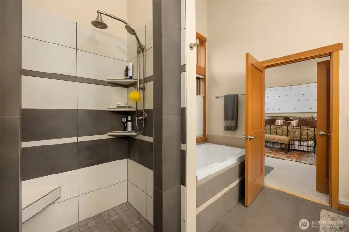 A large walk in shower was remodeled to be open and accessible. Shelves and seating were added for comfort.