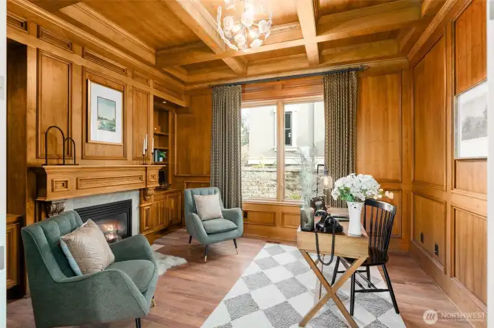 Main floor richly wood paneled and box beamed office.  Cozy Fireplace too.